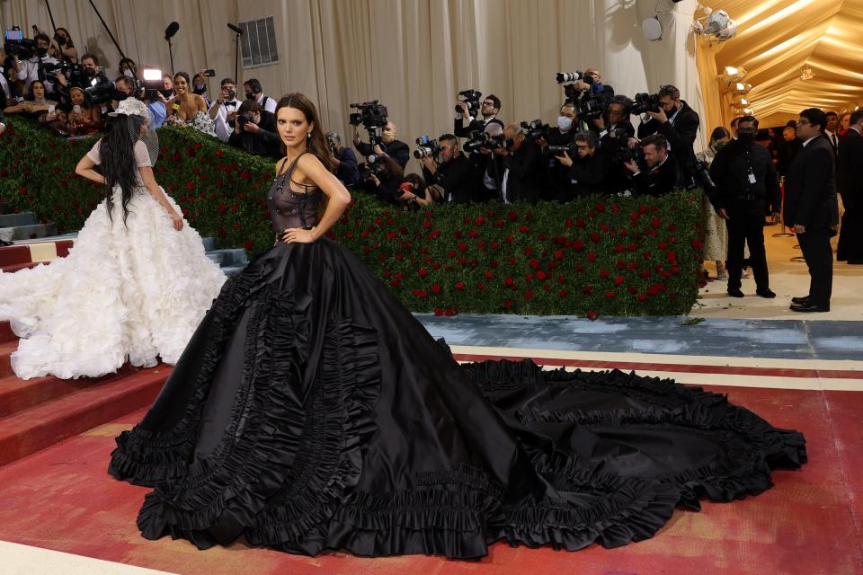 In contrast to her sister Kylie Jenner's all-white look, Kendall Jenner embraced the darkness, in a smoky ballgown.