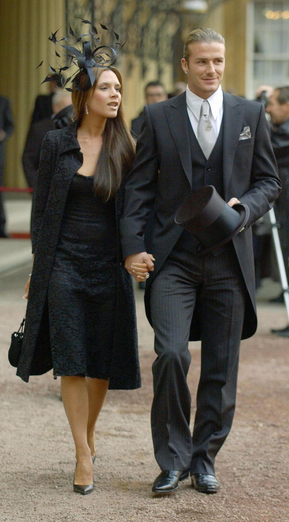 With David Beckham after he received an OBE at Buckingham Palace on November 27, 2003 (AFP via Getty Images)