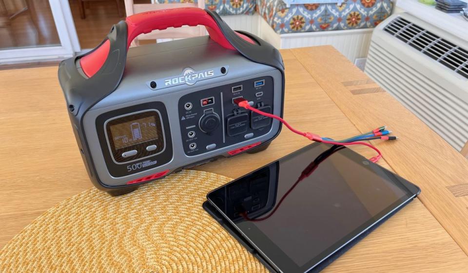 The Rockpals Rockpower 500W show charging an iPad.