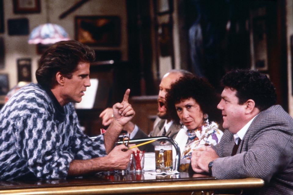 Ted Danson, Rhea Perlman, and George Wendt chatting at the bar