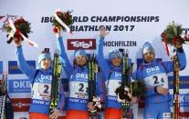 Biathlon - IBU World Championships - Men 4 x 7.5 km Relay - Hochfilzen, Austria - 18/2/17 - Alexey Volkov of Russia, Maxim Tsvetkov of Russia, Anton Babikov of Russia and Anton Shipulin of Russia on the podium. REUTERS/Leonhard Foeger