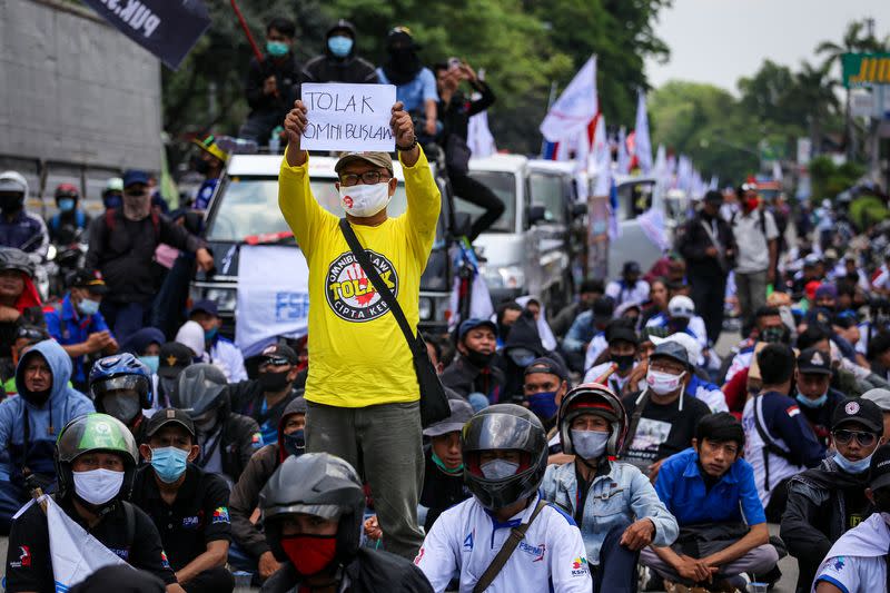 Members of Indonesian trade unions protest the government's proposed labour reforms in a controversial "jobs creation" bill in Tangerang, on the outskirts of Jakarta