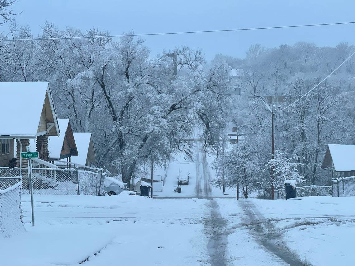 Snow covers the roads of the Ivanhoe Southwest neighborhood of Kansas City around 9:45 a.m. Tuesday morning, with more snow flurries still falling as a winter storm continues to move through the metro. This area had seen nearly 4 inches of snow at that time.