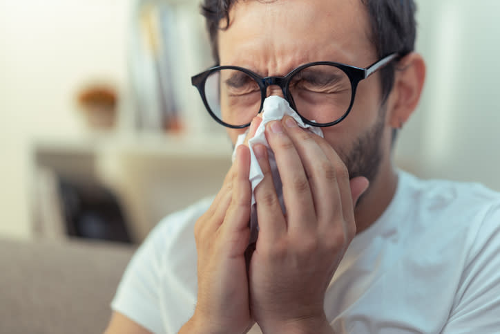 A man blowing his nose