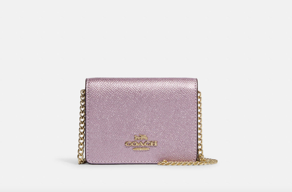 Mini Wallet On A Chain in metallic pink (Photo via Coach Outlet)