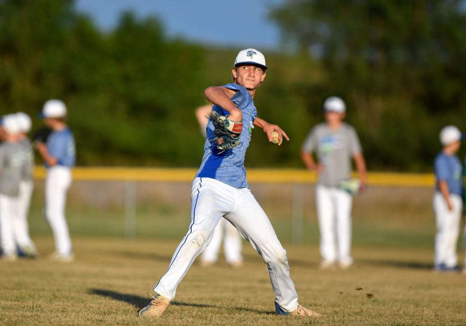 Gavin Weir throws a ball to home while trying out for a local baseball team on Monday, July 25, 2022, in Harrisburg, SD.
