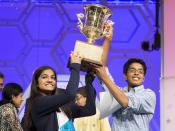 Vanya Shivashankar (L) of Olathe, Kansas, and Gokul Venkatachalam, St. Louis Missouri lift the trophy after becoming co-champions after the final round of the 88th annual Scripps National Spelling Bee at National Harbor, Maryland May 28, 2015. (REUTERS/Joshua Roberts)