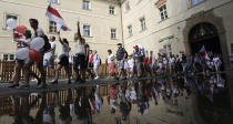 Demonstrators shout slogans as hundreds of people, among them many Belarusians, march in support of Belarusian demonstrators facing a brutal crackdown from the government of President Alexander Lukashenko downtown Prague, Czech Republic, Saturday, Aug. 15, 2020. (AP Photo/Petr David Josek)