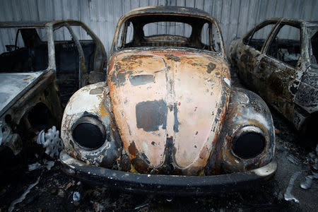 Burnt vehicles are seen after a forest fire in Miro, near Penacova, Portugal, October 17, 2017. REUTERS/Pedro Nunes