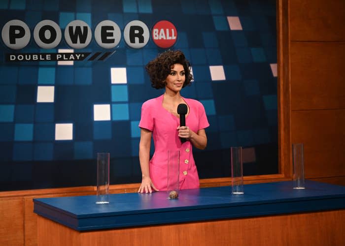 Kim Kardashian in a curly wig during a Powerball sketch