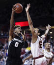 Providence center Nate Watson (0) puts up a shot over Boston College center Johncarlos Reyes, right, during the first half of an NCAA college basketball game in Boston, Tuesday, Dec. 4, 2018. (AP Photo/Charles Krupa)