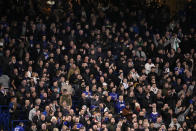 Chelsea supporters in the standing section ahead of the English Premier League soccer match between Chelsea and Liverpool at Stamford Bridge in London, Sunday, Jan. 2, 2022. It is the first time standing sections have been allowed at Premier League stadiums since 1994. Chelsea is one of the clubs allowed by British authorities to take part in a pilot scheme that will allow some clubs to trial licensed standing areas from this month. (AP Photo/Matt Dunham)