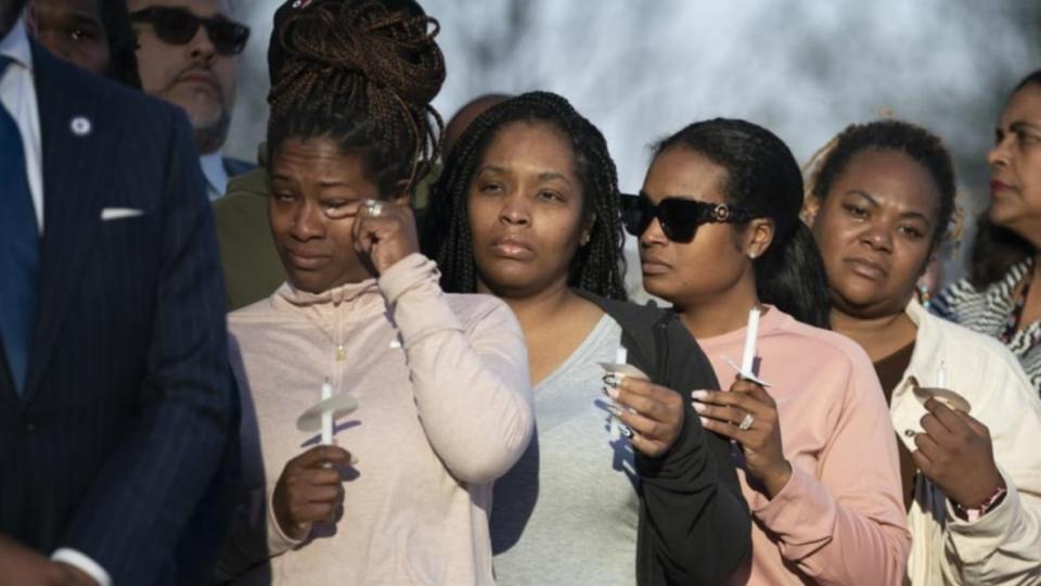 A mourner wipes away a tear during the “Nashville Remembers” candlelight vigil on March 29, 2023, at Public Square Park in Nashville, Tennessee, to honor the victims of The Covenant School mass shooting. (Photo: Andrew Nelles/The Tennessean via AP)