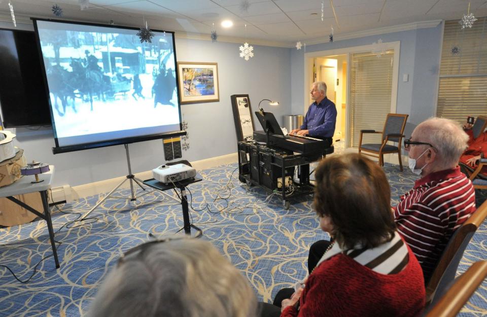 Allerton House residents enjoy the1 1916 silent movie, "Santa Claus" as pianist Richard Hughes provides the accompanying music at the Allerton House in Weymouth, Sunday, Dec. 11, 2022. Tom Gorman/For The Patriot Ledger