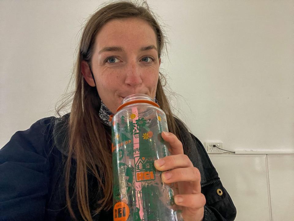 The author with the reusable water bottle she packs for flights.