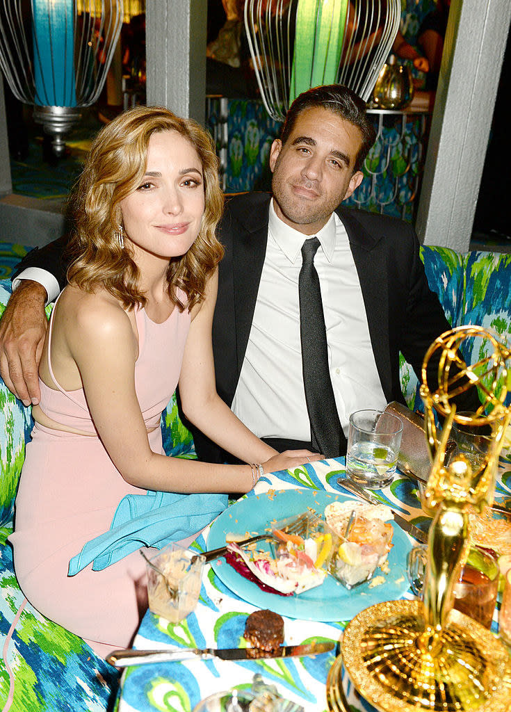 Rose Byrne (L) and Bobby Cannavale sitting at a dinner table at HBO's official Emmy after party