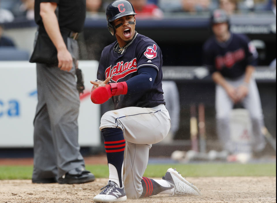 Cleveland Indians' Francisco Lindor reacts after scoring on a Jason Kipnis sacrifice fly during the eighth inning of a baseball game against the New York Yankees in New York, Sunday, May 6, 2018. (AP Photo/Kathy Willens)