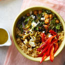 <p>Our favorite part of these vegetarian grain bowls is the tangy lemon vinaigrette, which ties together a satisfying combo of quinoa, toasted pumpkin seeds, and roasted chickpeas and kale. Whip them up for easy meal-prep lunches or a healthy and satisfying dinner. <a href="https://www.eatingwell.com/recipe/269117/crispy-chickpea-grain-bowl-with-lemon-vinaigrette/" rel="nofollow noopener" target="_blank" data-ylk="slk:View Recipe;elm:context_link;itc:0;sec:content-canvas" class="link ">View Recipe</a></p>