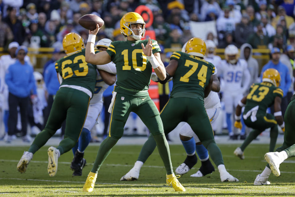 Green Bay Packers quarterback Jordan Love (10) throws a pass against the Los Angeles Chargers during the first half of an NFL football game, Sunday, Nov. 19, 2023, in Green Bay, Wis. (AP Photo/Mike Roemer)
