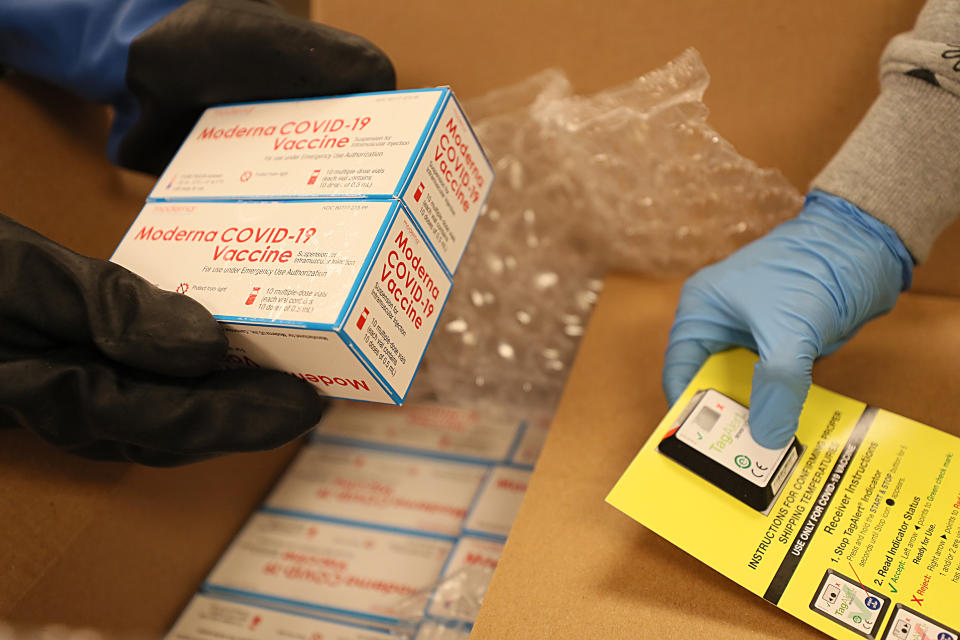 Moderna's COVID-19 vaccine is unpacked in the pharmacy of Boston Medical Center. (Suzanne Kreiter/The Boston Globe via Getty Images)