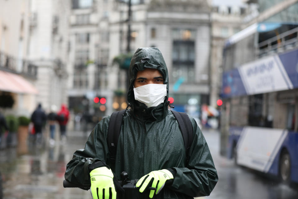 A man wears a face mask on Haymarket, London, as the first case of coronavirus has been confirmed in Wales and two more were identified in England - bringing the total number in the UK to 19. (Photo by Luciana Guerra/PA Images via Getty Images)