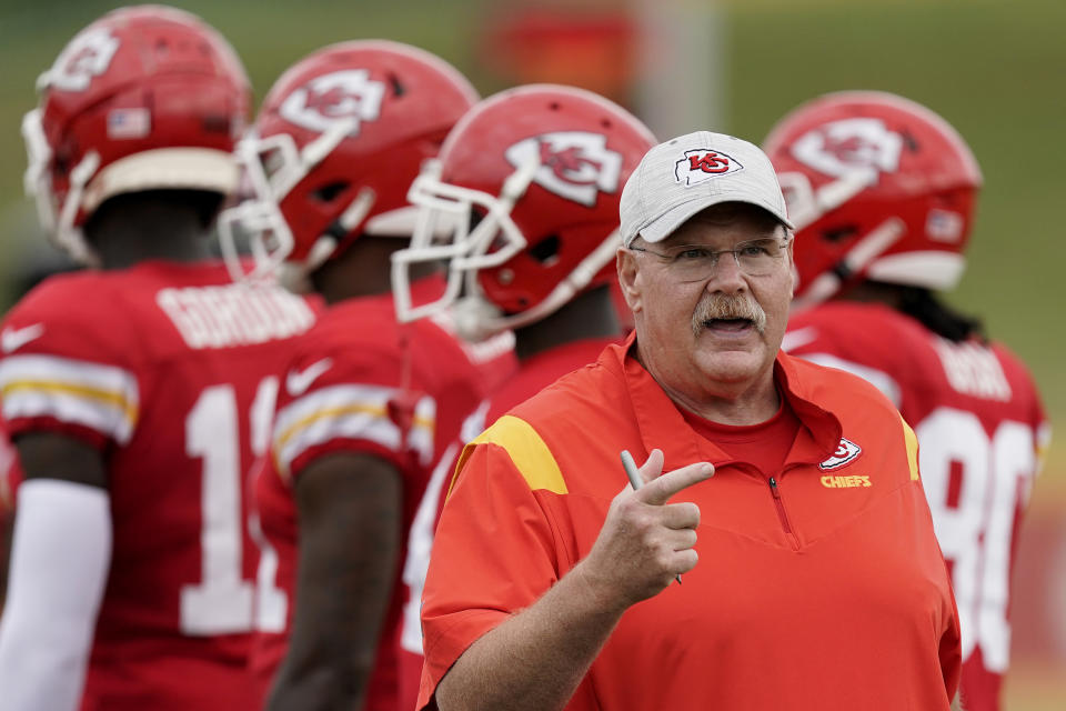 Kansas City Chiefs head coach Andy Reid talks to players during NFL football training camp Monday, Aug. 15, 2022, in St. Joseph, Mo. (AP Photo/Charlie Riedel)