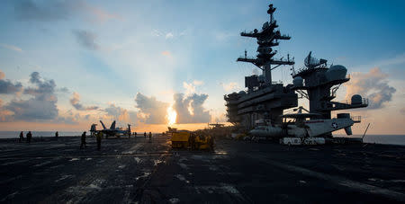 FILE PHOTO - The aircraft carrier USS Carl Vinson (CVN 70) transits the South China Sea, April 8, 2017. Photo taken April 8, 2017. U.S. Navy photo by Mass Communication Specialist 3rd Class Matt Brown/Handout via Reuters/File Photo