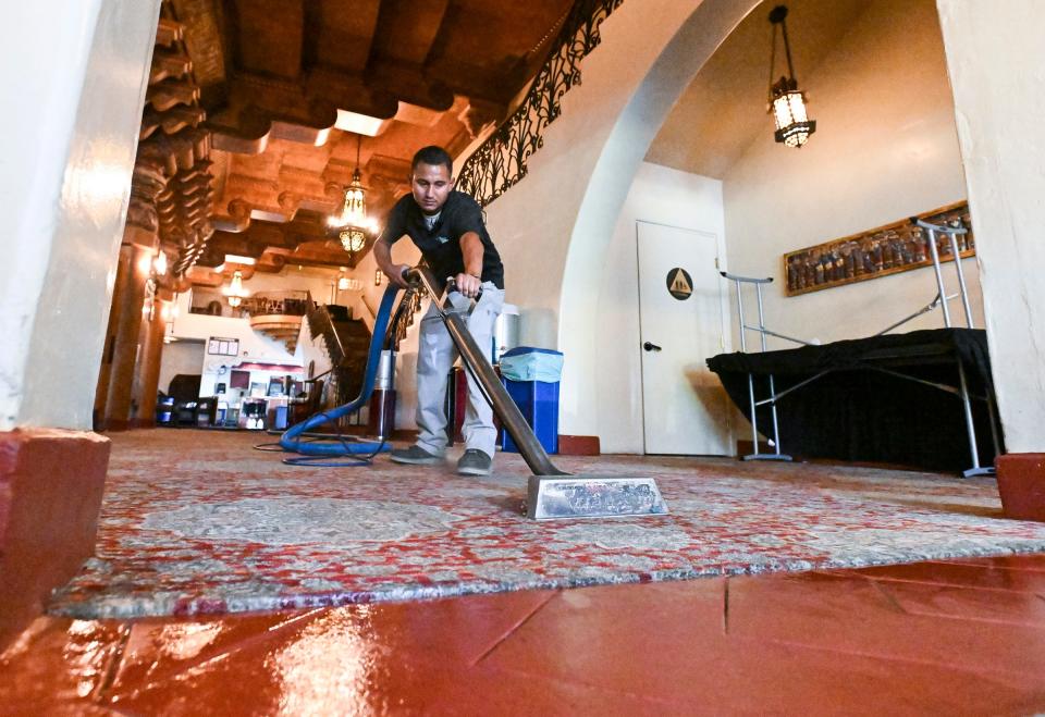 Barayn Cruz from ServiceMaster by Benevento works Friday, May 6, 2022  in the lobby of the Fox Theater to remove smoke damage from Sunday's fire in neighboring businesses. 