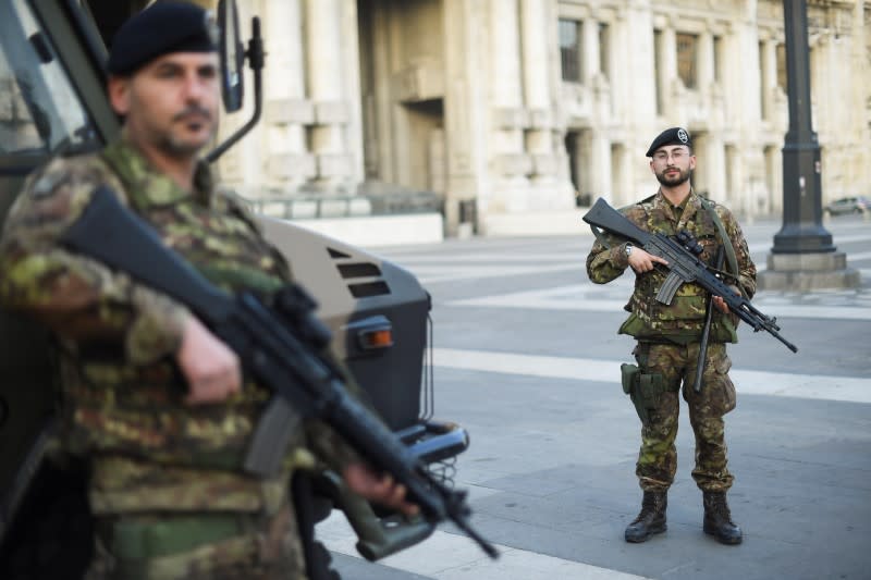Italian army soldiers patrol streets after being deployed to the region of Lombardy to enforce the lockdown against the spread of coronavirus disease (COVID-19) in Milan