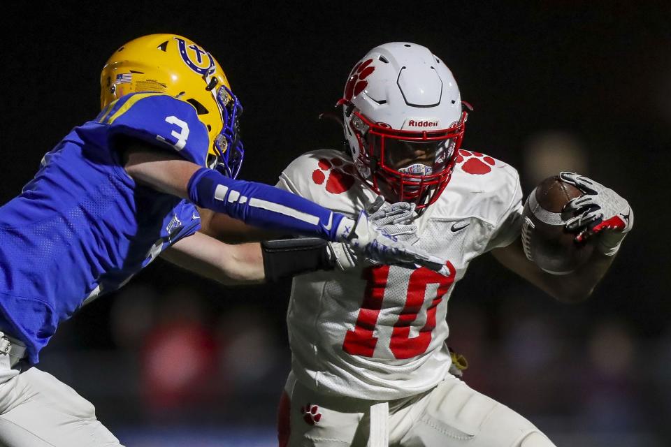 Beechwood running back Antonio Robinson (10) runs with the ball against Newport Central Catholic cornerback Matthew Landrum (3) in the second half at Covington Catholic High School Oct. 28, 2022.