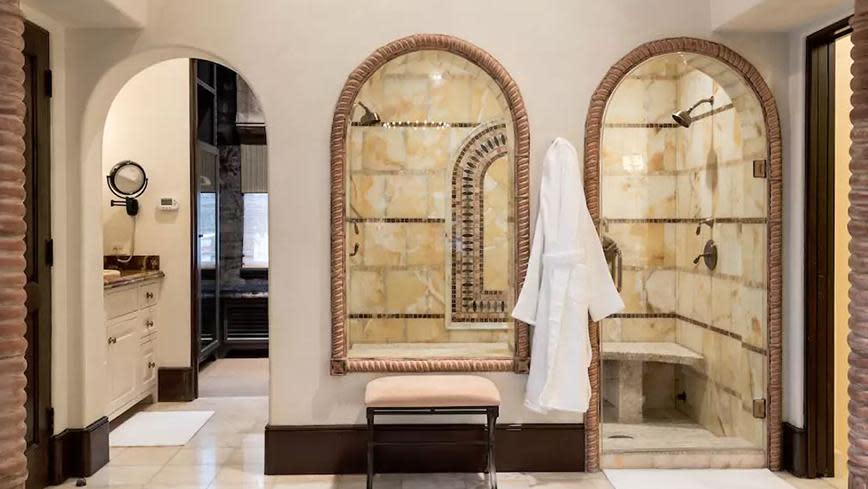 There are 5.5 bathrooms spread throughout the house, all decorated in an extravagant Mediterranean style.