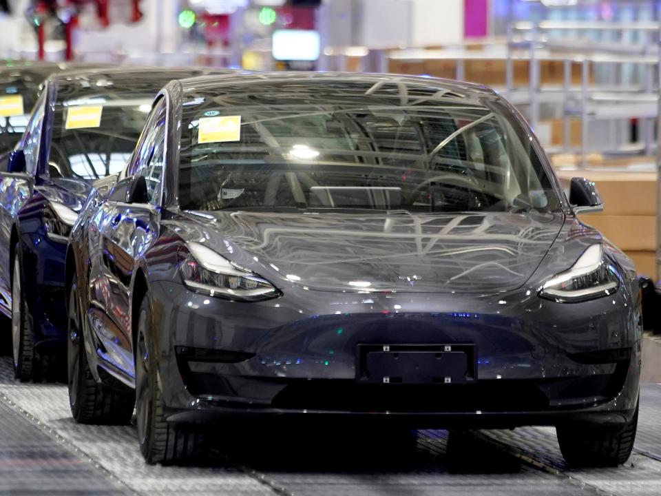 FILE PHOTO: Tesla China-made Model 3 vehicles are seen during a delivery event at its factory in Shanghai, China January 7, 2020. REUTERS/Aly Song/File Photo