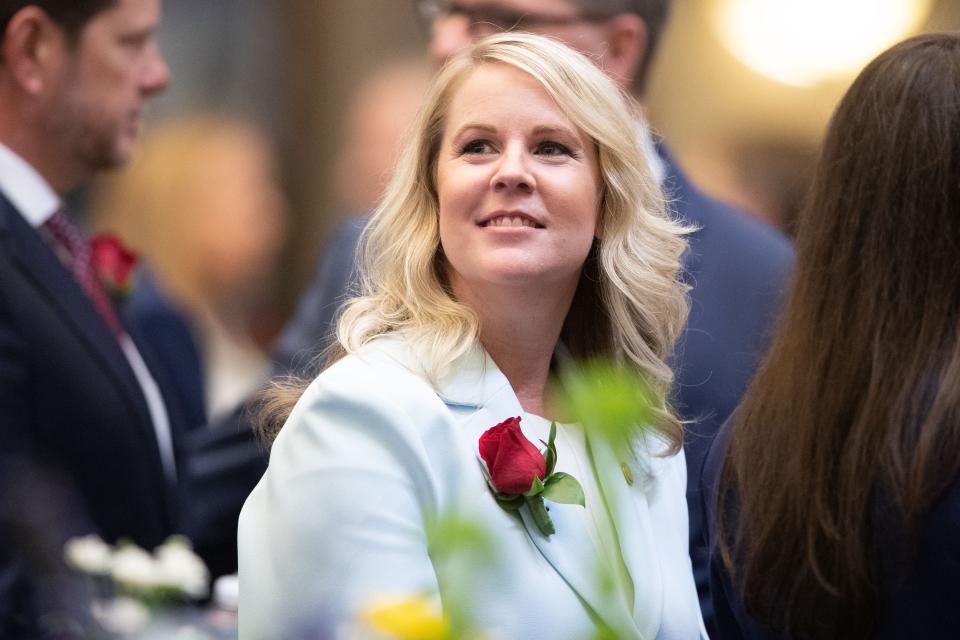 Rep. Jenna Persons-Mulicka talks with other representatives during the opening day of the 2024 Legislative Session on Tuesday, Jan. 9, 2024.