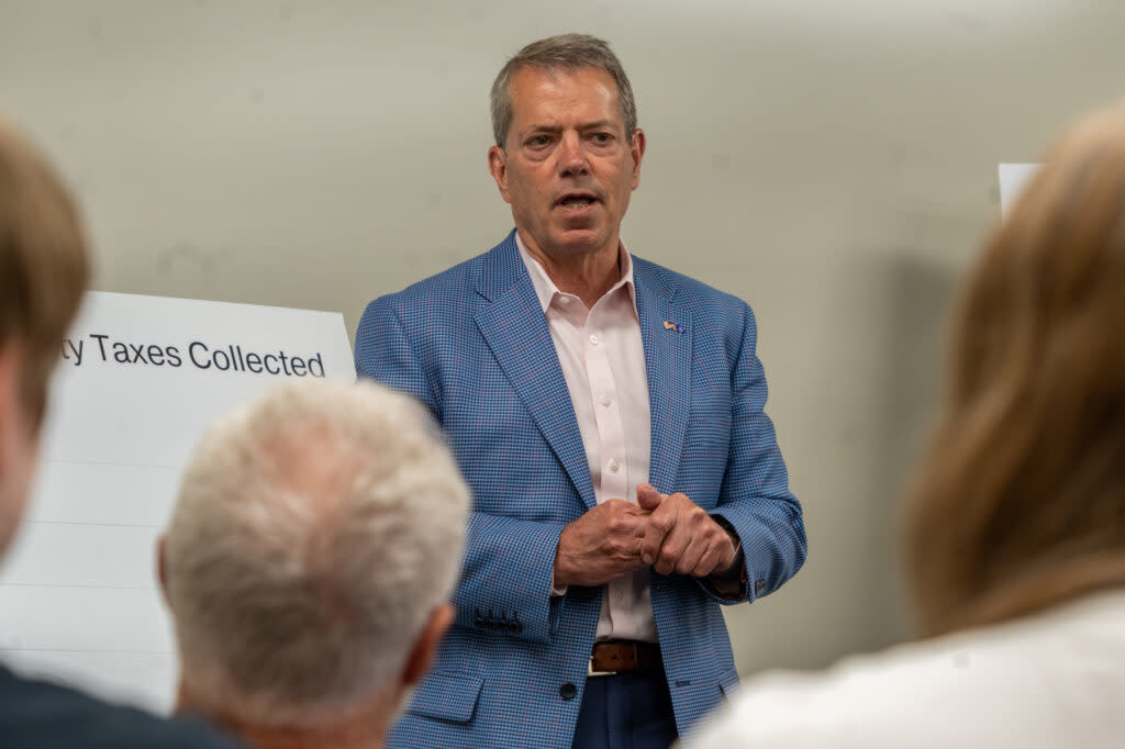 Gov. Jim Pillen addresses attendees at a property tax town hall in Plattsmouth.