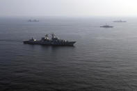 In this photo provided Friday, Jan. 21, 2022, by the Iranian Army, warships attend a joint naval drill of Iran, Russia and China in the Indian Ocean. Iran's state TV said 11 of its vessels were joined by three Russian ships including a destroyer, and two Chinese vessels. Iran's Revolutionary Guard will also participate with smaller ships and helicopters. (Iranian Army via AP)