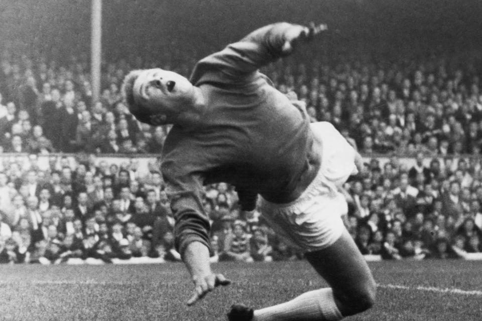 Harry Gregg makes a save during a match against Arsenal at Highbury in 1963 (Getty Images)