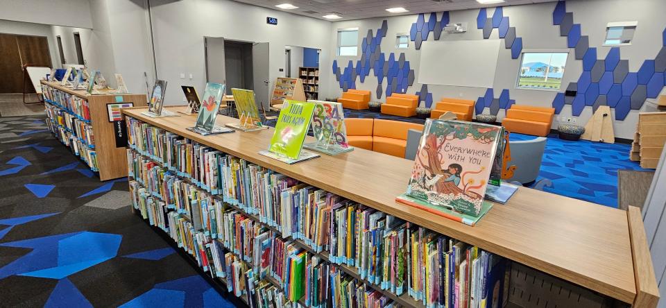 A children's room offers age-appropriate reading and space for caretakers to sit and read with their children.