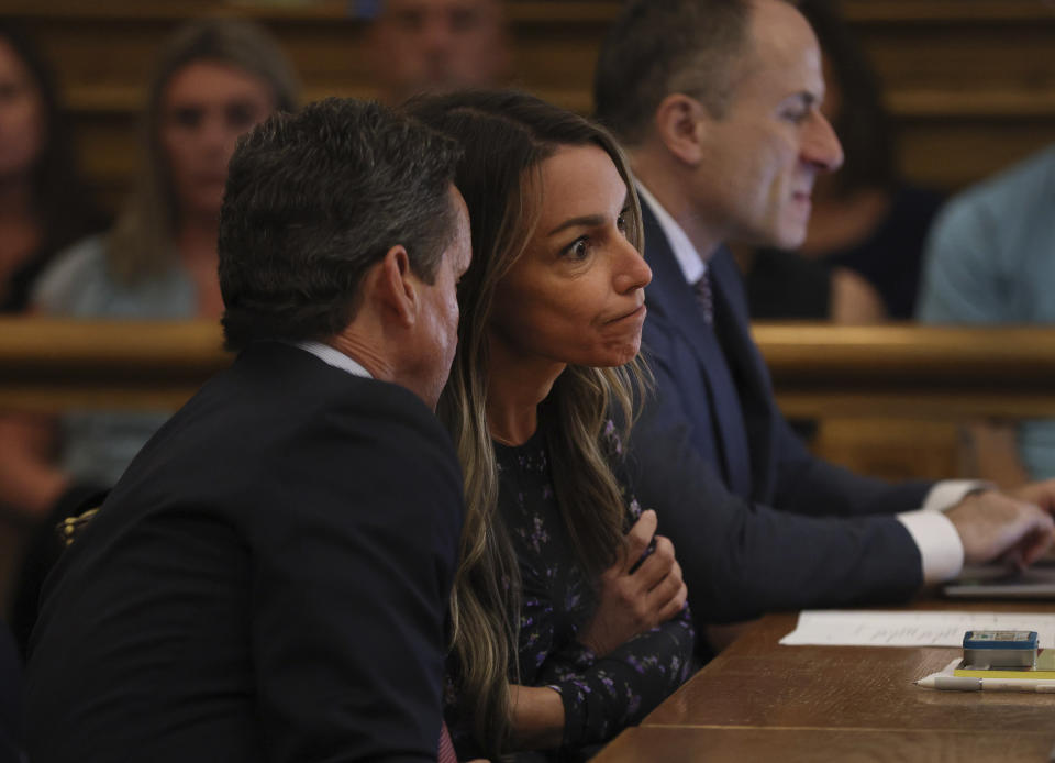 Karen Read listens to her attorney, Alan Jackson, during closing arguments in her trial at Norfolk Superior Court on Tuesday, June 25, 2024 in Dedham, Mass. Read is accused of killing her boyfriend Boston police Officer John O'Keefe, in 2022. (Nancy Lane/The Boston Herald via AP, Pool)