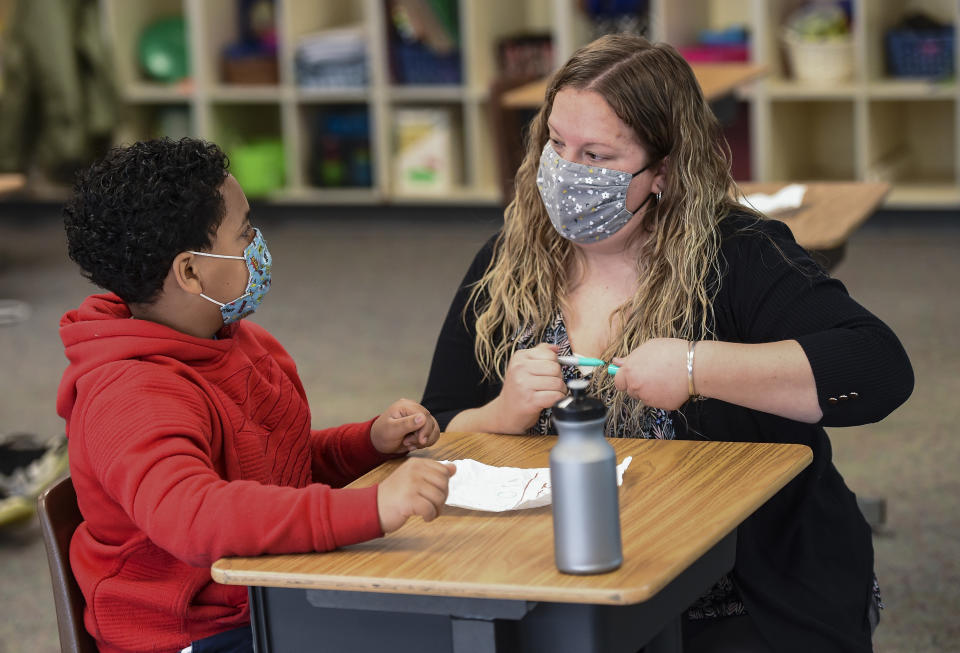 Cumru Twp, PA - April 14: Sabrina Werley works with 4th grade student Jeremiah Ruiz during a math support class. During class with Learning Support teacher Sabrina Werley at Cumru Elementary School in Cumru township Wednesday morning April 14, 2021. Werley is the 2021 recipient of the Annie Sullivan Award, which recognizes local educators for their service to students with special needs. (Photo by Ben Hasty/MediaNews Group/Reading Eagle via Getty Images)