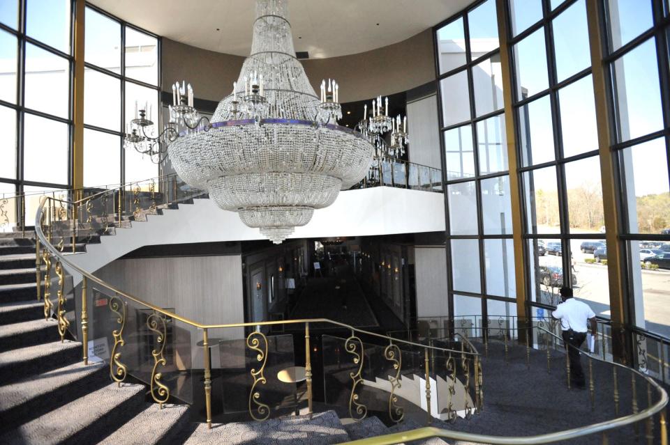 A court officer decends the staircase at Lombardo's in Randolph that has been transformed into a courthouse, Tuesday, April 20, 2021. Tom Gorman/For The Patriot Ledger 