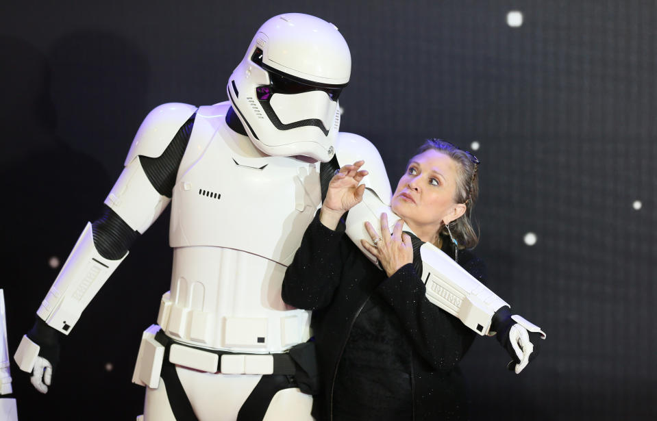 Carrie Fisher poses for cameras as she arrives at the European Premiere of Star Wars, The Force Awakens in Leicester Square, London, December 16, 2015.     REUTERS/Paul Hackett 