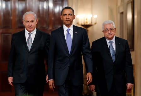 FILE PHOTO: U.S. President Obama arrives with Israeli PM Netanyahu and Palestinian President Abbas to make a statement on Middle East Peace talks at the White House