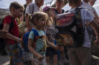 Internally displaced people board a train heading to Dnipro, at the Pokrovsk train station, Donetsk region, eastern Ukraine, Friday, July 8, 2022. (AP Photo/Nariman El-Mofty)