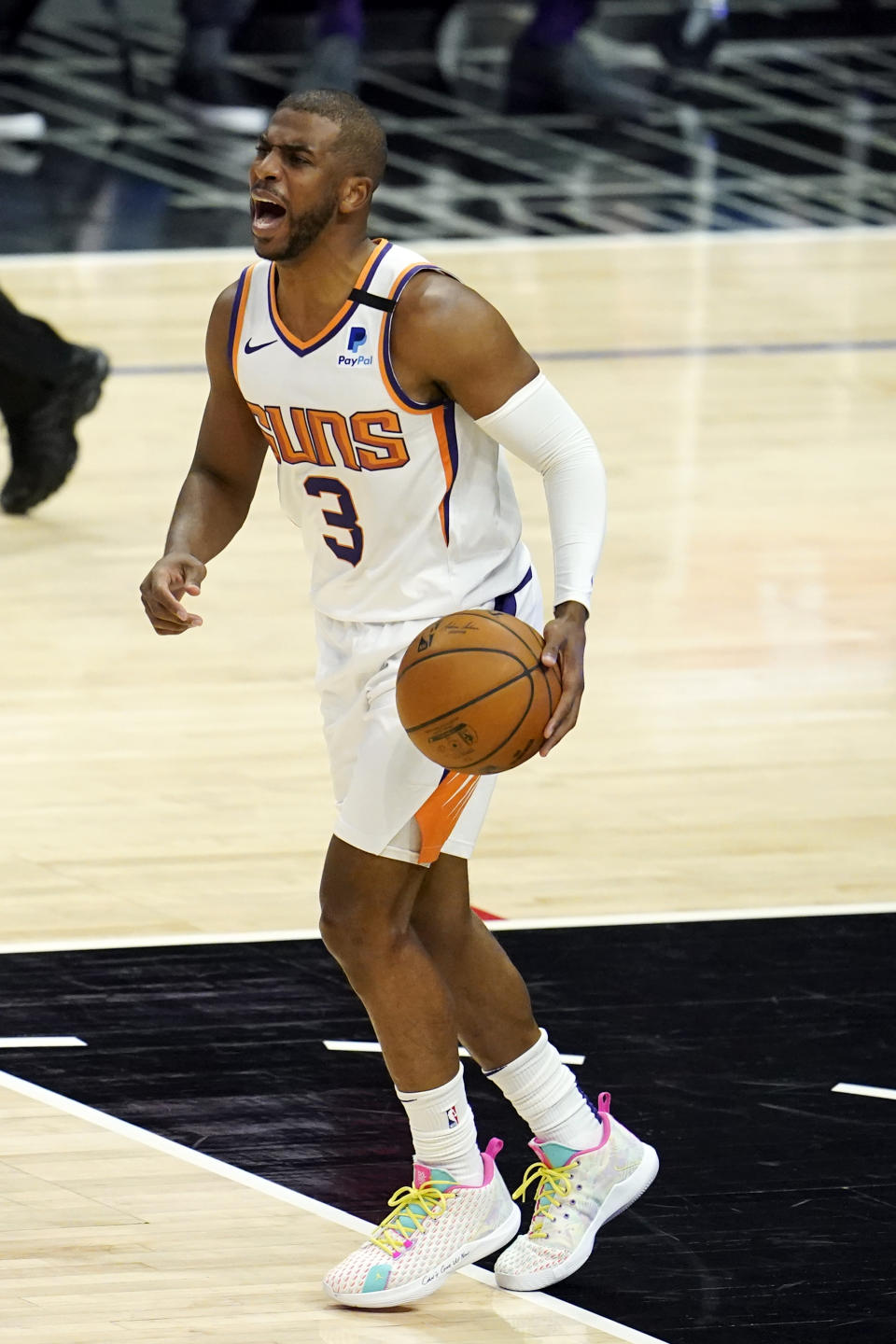 Phoenix Suns guard Chris Paul yells out instructions as he dribbles during the first half of an NBA basketball game against the Los Angeles Clippers Thursday, April 8, 2021, in Los Angeles. (AP Photo/Marcio Jose Sanchez)