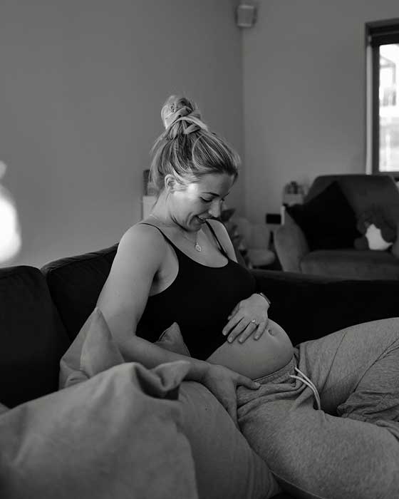 Gemma Atkinson cradling her baby bump