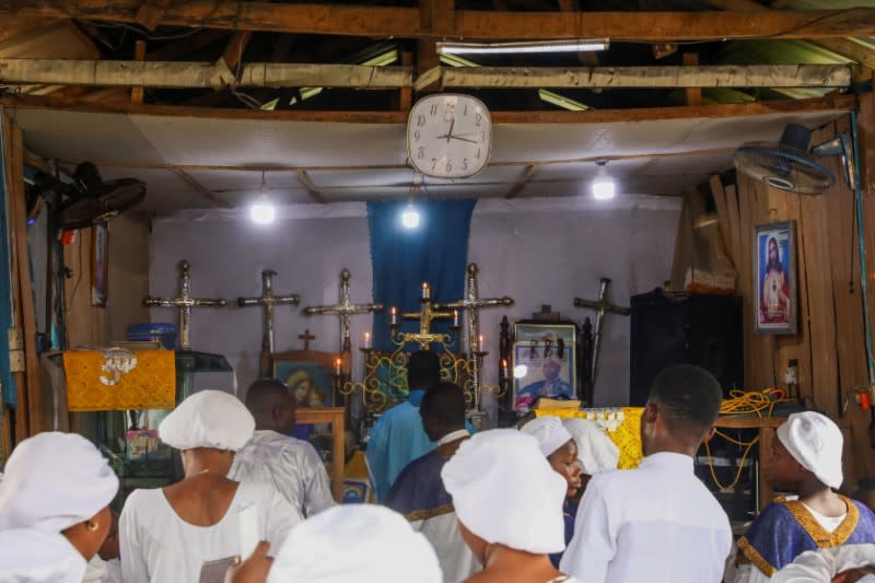 Faithfuls worship during a church service amid concerns about the spread of coronavirus disease (COVID-19) at the Celestial Church of Christ, in Makoko community area in Lagos