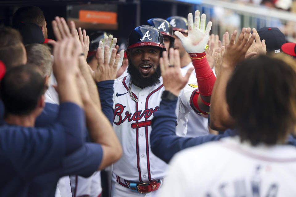 Atlanta Braves' Marcell Ozuna (20) is congratulated for a three-run home run against the Boston Red Sox during the first inning of a baseball game Wednesday, May 8, 2024, in Atlanta. (Jason Getz/Atlanta Journal-Constitution via AP)