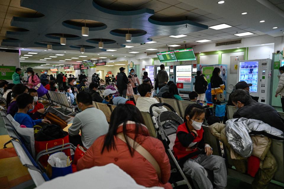 Children and their parents wait at an outpatient area at a children hospital in Beijing on November 23, 2023. The World Health Organization has asked on November 23, 2023, China for more data on a respiratory illness spreading in the north of the country, urging people to take steps to reduce the risk of infection. China has reported an increase in 