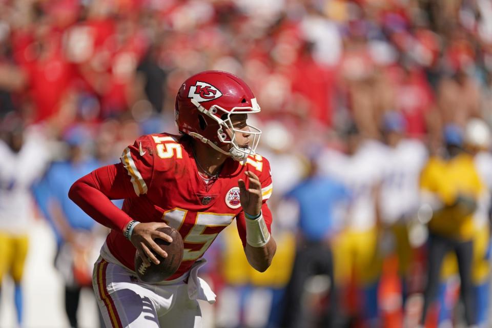 Kansas City Chiefs quarterback Patrick Mahomes runs the ball.