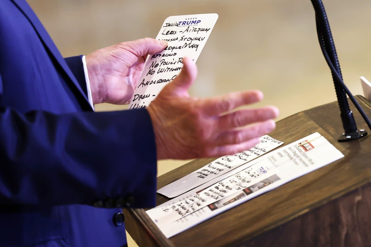 Donald Trump holds notes for his remarks at Trump Tower on September 6 (Getty Images)